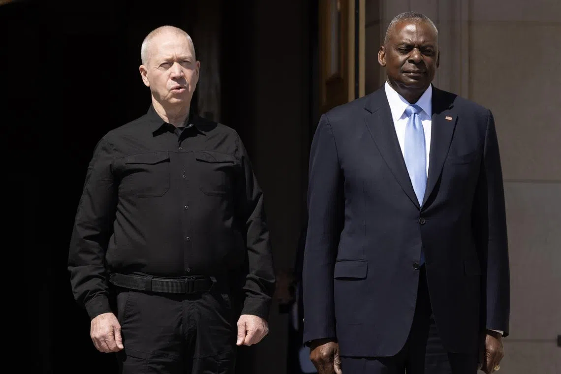Israeli Defense Minister Yoav Gallant (L) and US Secretary of Defense Lloyd Austin (R) observe the playing of the national anthem of Israel by a US military band during an honor cordon at the Pentagon in Arlington, Virginia, USA, 25 June 2024. US Secretary of Defense Lloyd Austin met with Israeli Defense Minister Yoav Gallant at the Pentagon and discussed the ongoing situation in Gaza and Israeli military operations in the region.  EPA-EFE/MICHAEL REYNOLDS