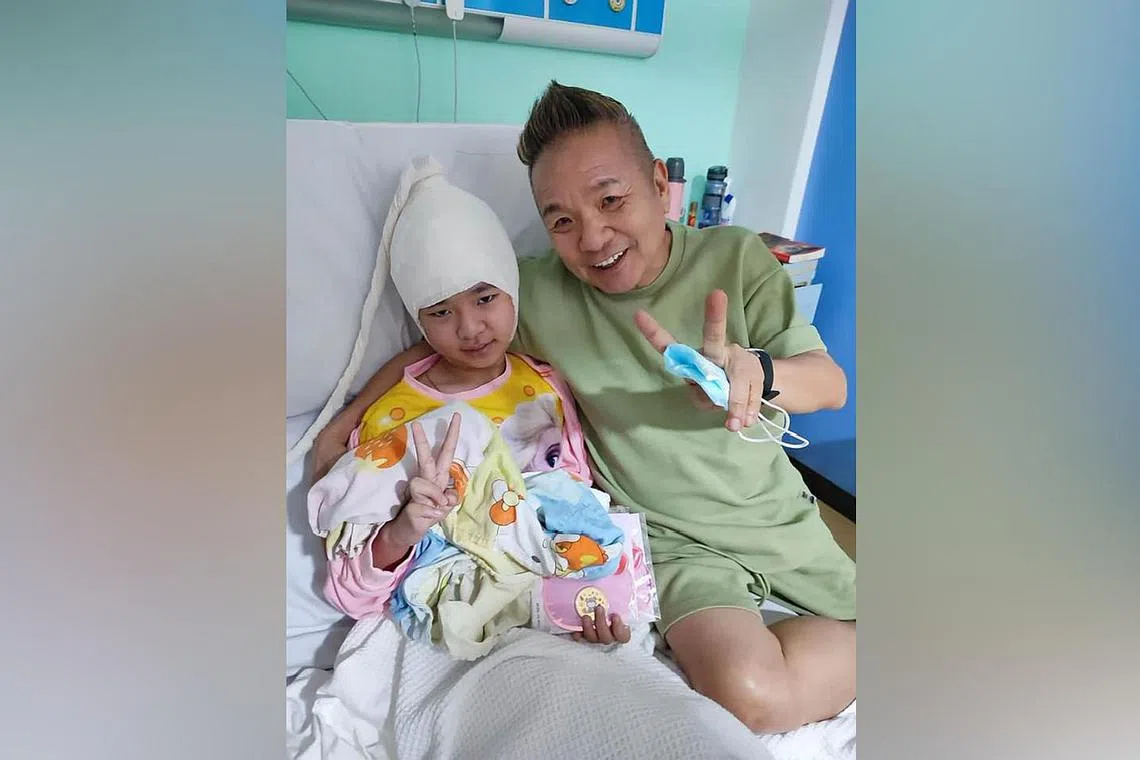 Local artiste Marcus Chin and his daughter Elise.