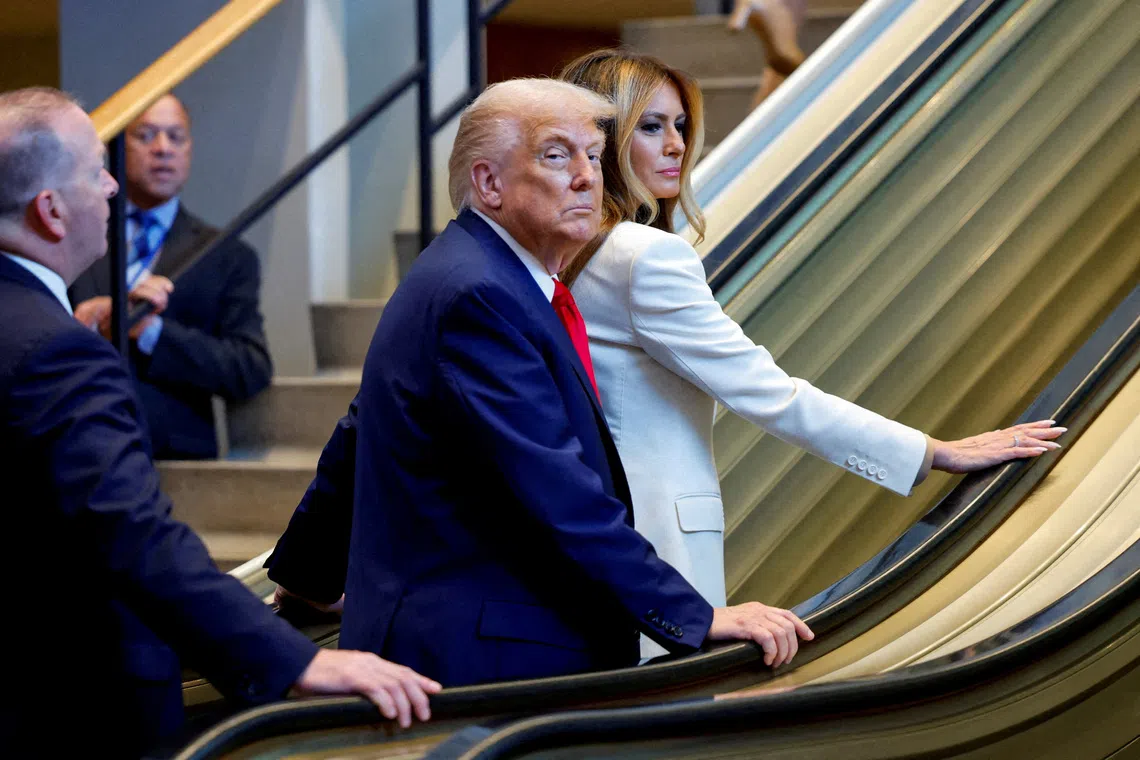 FILE PHOTO: U.S. President Donald Trump and first lady Melania Trump ride an escalator as they arrive to attend the 80th United Nations General Assembly, in New York City, New York, U.S., September 23, 2025. REUTERS/Kylie Cooper/File Photo