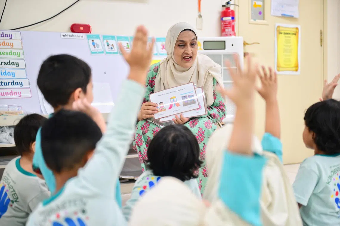 Ms Reema Bhatti, 55, a kindergarten teacher who suffered a stroke, is back at work at Al Istiqamah Kindergarten a month after her recovery. 

ST PHOTO: AZMI ATHNI