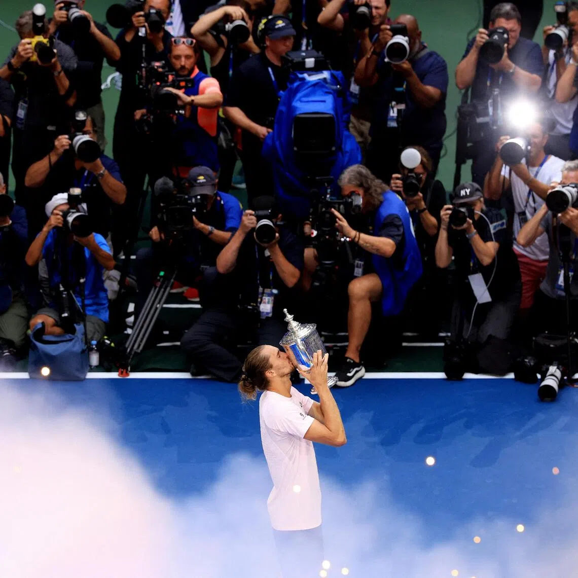 Germany’s Alexander Zverev celebrates with the trophy after winning the men’s singles final.