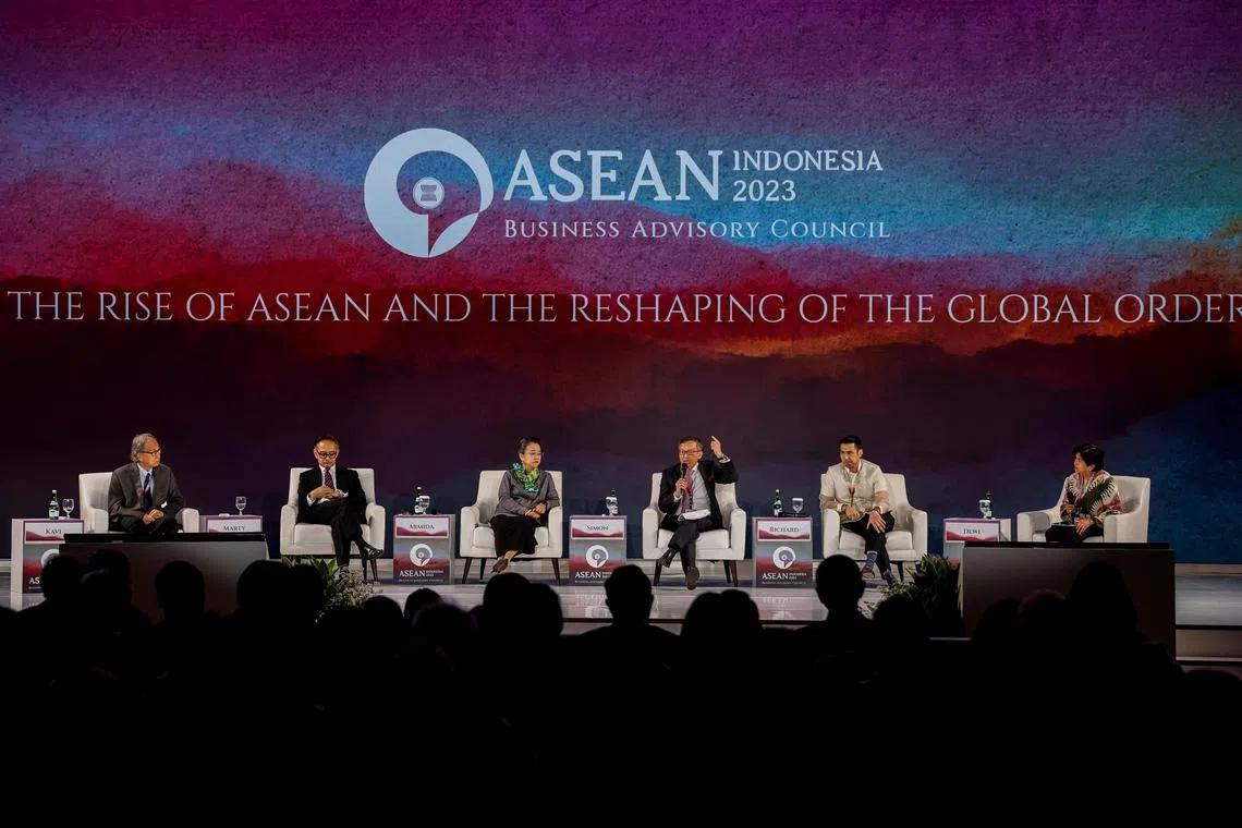 Simon Tay, Chairman of Singapore Institute of International Affairs (SIIA), speaks, as Kavi Chongkittavorn, Senior Communications Advisor Economic Research Institute for ASEAN and East Asia (ERIA), Marty Natalegawa, Former Indonesian Minister of Foreign Affairs, Armida Salsiah Alisjahbana, Under-Secretary-General of the United Nations Executive Secretary of United Nations Economic and Social Commission for Asia and the Pacific (UNESCAP), Richard Heydarian, Global columnist, academic and policy adviser, and Senior Lecturer at the University of the Philippines, and the moderator Dewi Fortuna Anwar, Chairman and Member of the Board of Directors for The Habibie Center, listen, during a plenary at the ASEAN Business and Investment Summit, in Jakarta, Indonesia, September 3, 2023. REUTERS/Willy Kurniawan