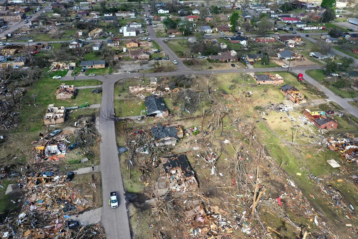 In an aerial view, piles of debris remain where homes once stood before Friday's EF-4 tornado on March 26, in Rolling Fork, Mississippi. At least 26 people died when the tornado ripped through the small town and other nearby communities.   