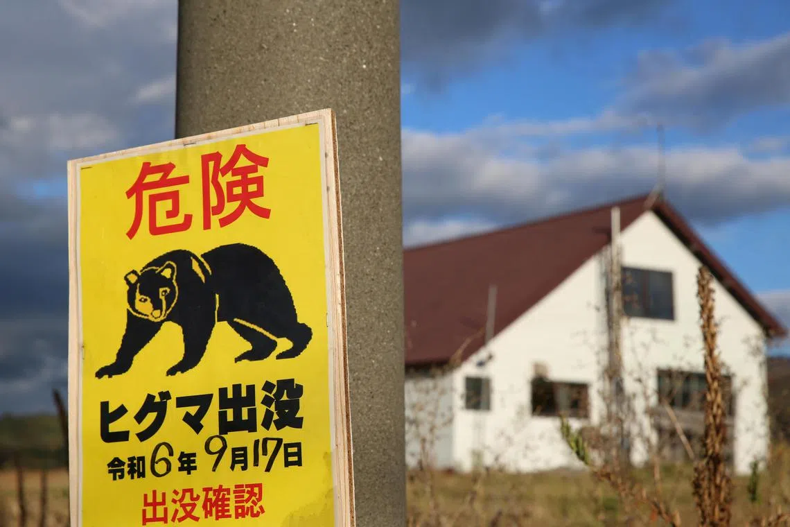 A sign warns of a nearby bear sighting in Takikawa, Hokkaido Prefecture, Japan on Oct 17, 2024.