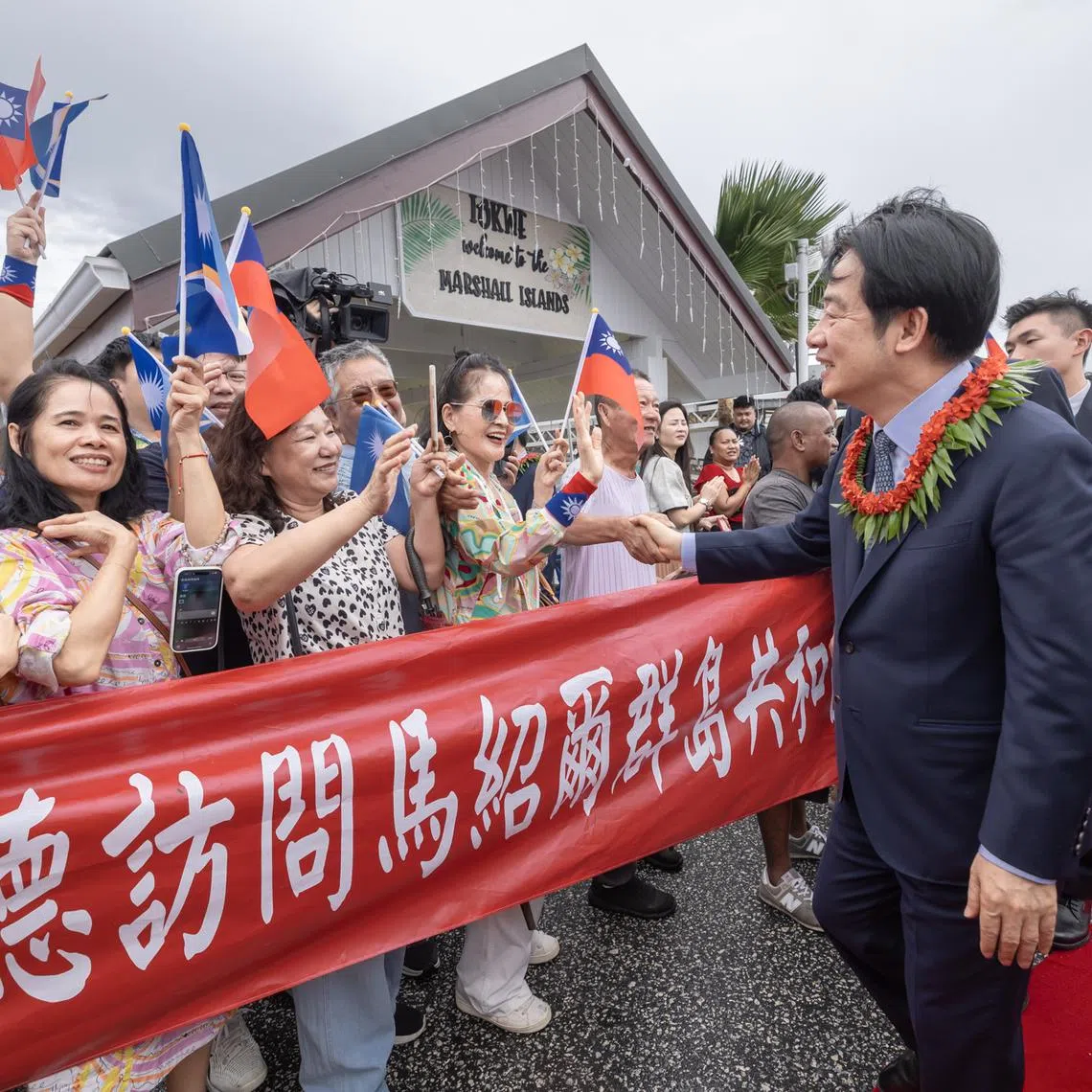 Taiwan President Lai Ching-te being greeted by members of the public at the international airport in Majuro, Marshall Islands, on Dec 3.