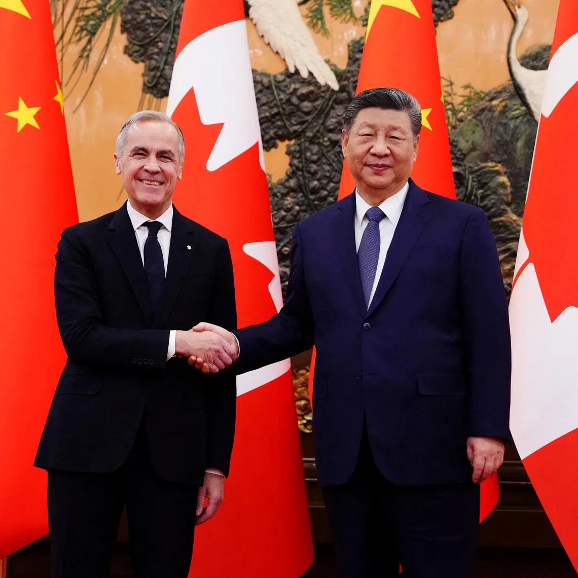 Canadian Prime Minister Mark Carney shakes hands with President of China Xi Jinping at the Great Hall of the People in Beijing, China on Friday, Jan. 16, 2026. Sean Kilpatrick/Pool via REUTERS