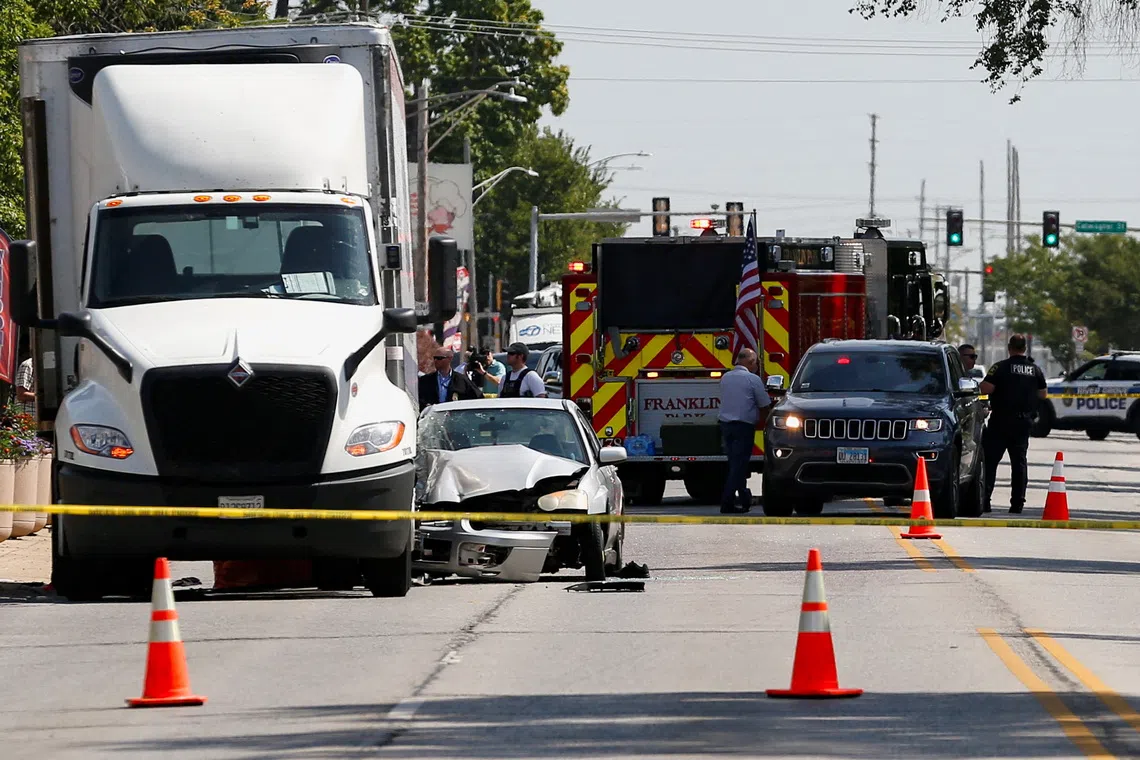 Police and first responders work at a cordoned-off area following reports that an Immigration and Customs Enforcement (ICE) agent shot an undocumented immigrant during a pursuit in Franklin Park village, northwest of Chicago, in Cook County, Illinois, U.S., September 12, 2025. REUTERS/Octavio Jones
