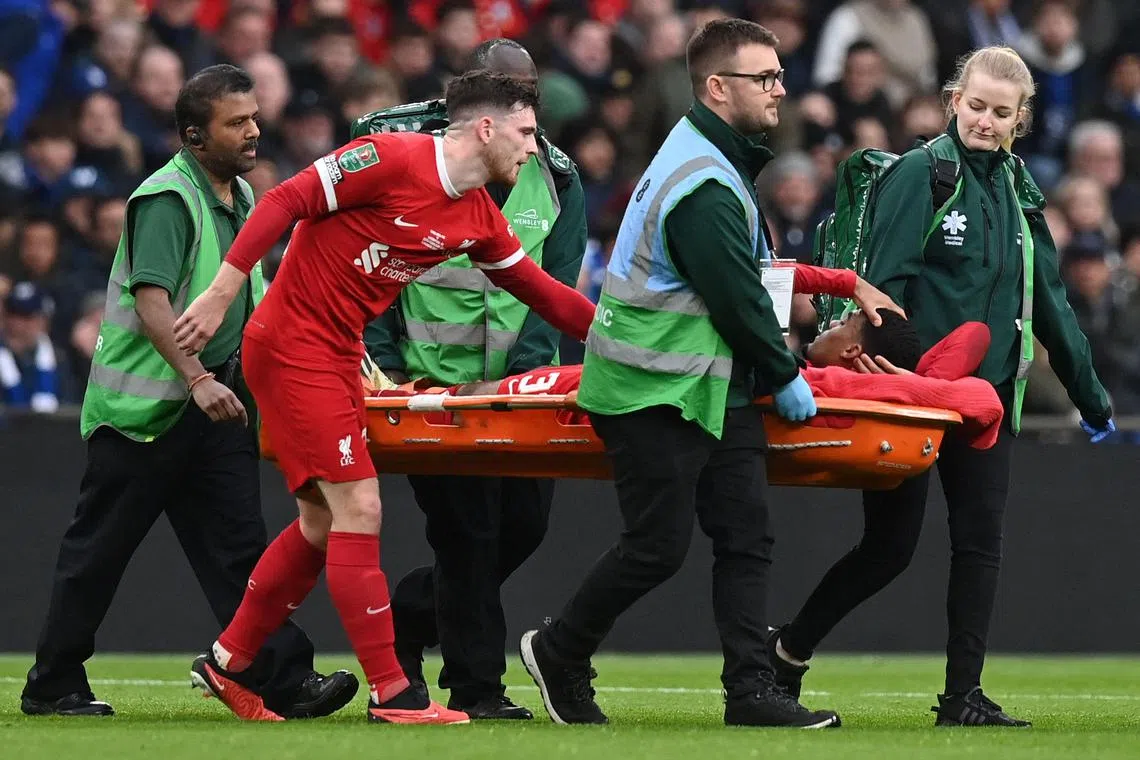 Liverpool midfielder Ryan Gravenberch is carried off injured on a stretcher during the League Cup final win over Chelsea.