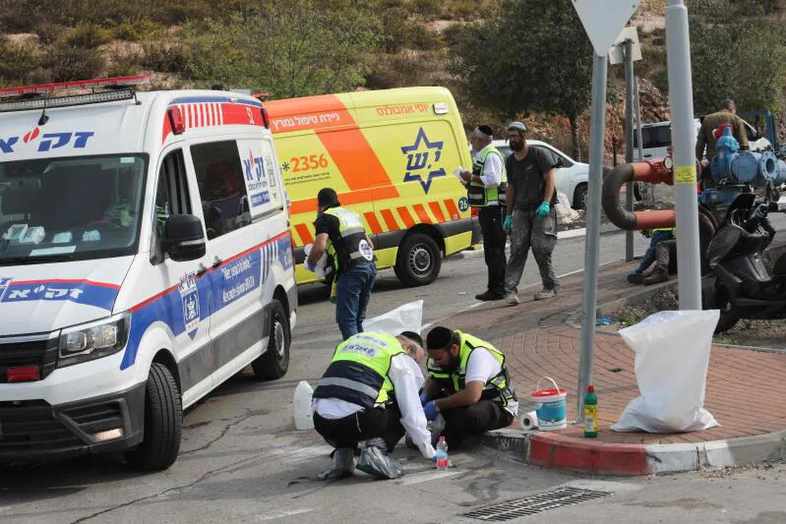 Israeli Zaka emergency response volunteers working at the scene of a knife attack in the West Bank on Nov 15, 2022.