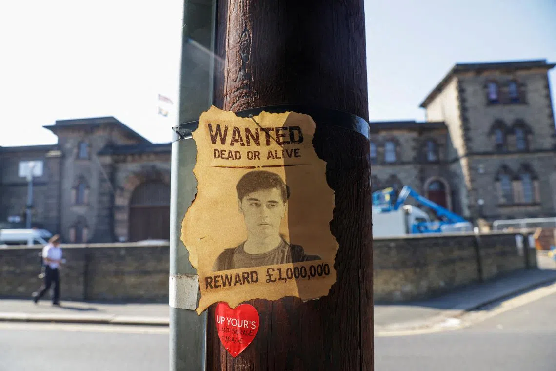 A wanted sign featuring an image of Daniel Abed Khalife, a former soldier who is suspected of terrorism offences, is displayed near Wandsworth prison in London, Britain, September 7, 2023. REUTERS/Anna Gordon/File Photo