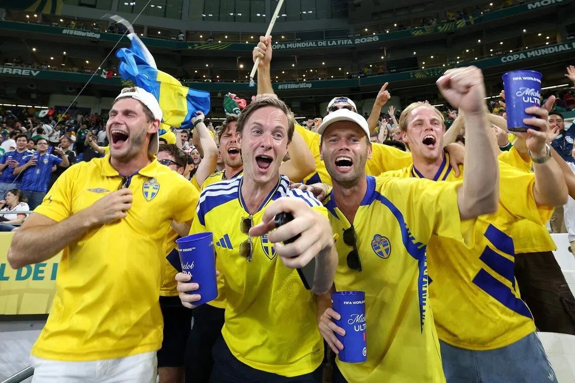 Sweden's fans celebrate after their team won the 2026 World Cup Group F football match with Tunisia.