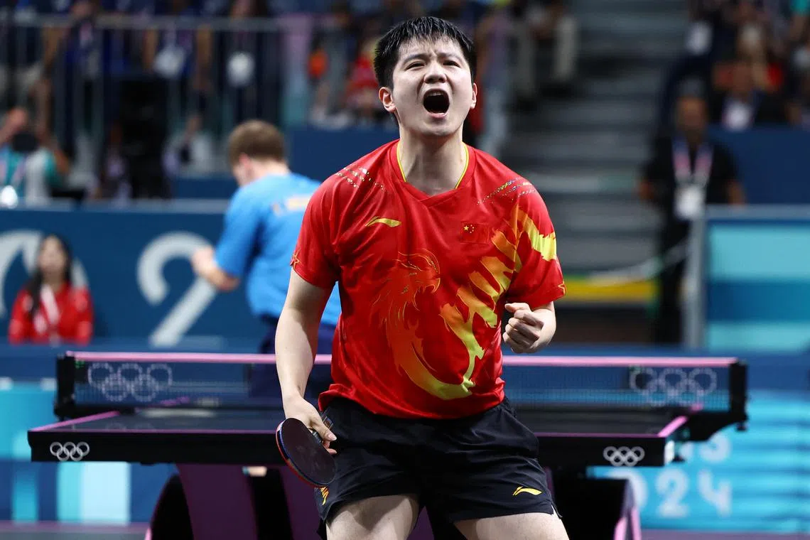 Paris 2024 Olympics - Table Tennis - Men's Singles Gold Medal Match - South Paris Arena 4, Paris, France - August 04, 2024. Zhendong Fan of China celebrates after winning his gold medal match against Truls Moregard of Sweden. REUTERS/Stephanie Lecocq