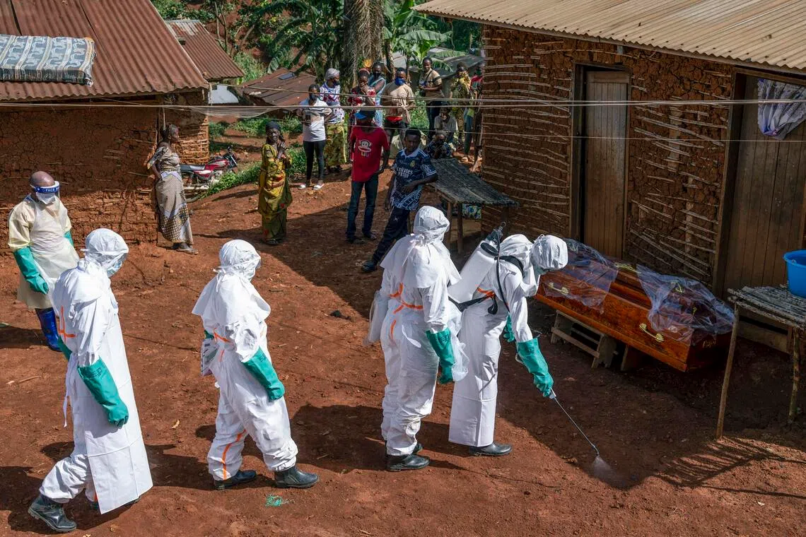 NYTSELECTS -- Health workers disinfect the entrance to a house in Bunia, as part of the response to the Ebola outbreak in the Democratic Republic of Congo, on Sunday, May 24, 2026. The deadly virus has spread alarmingly in Congo for months. Only now is the response taking shape. (Arlette Bashizi/The New York Times)