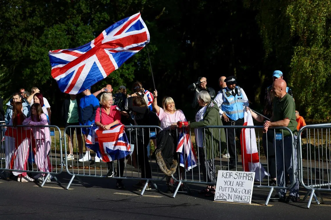 Protesters gather outside The Bell Hotel, as the British government won a court ruling resulting in asylum seekers not being evicted from the hotel in Epping, Britain, August 31, 2025. REUTERS/Jack Taylor