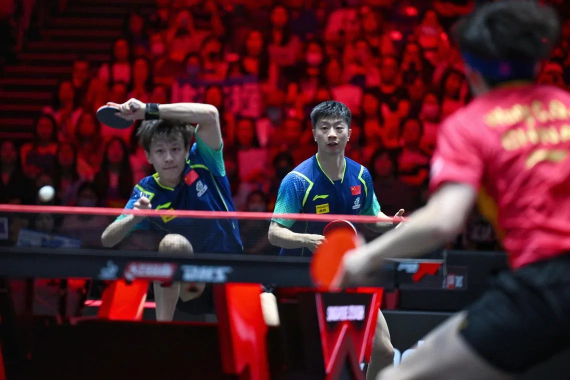 Chinese table tennis players Lin Gaoyuan (left) and Ma Long won the men's doubles title at the 2024 Singapore Smash.