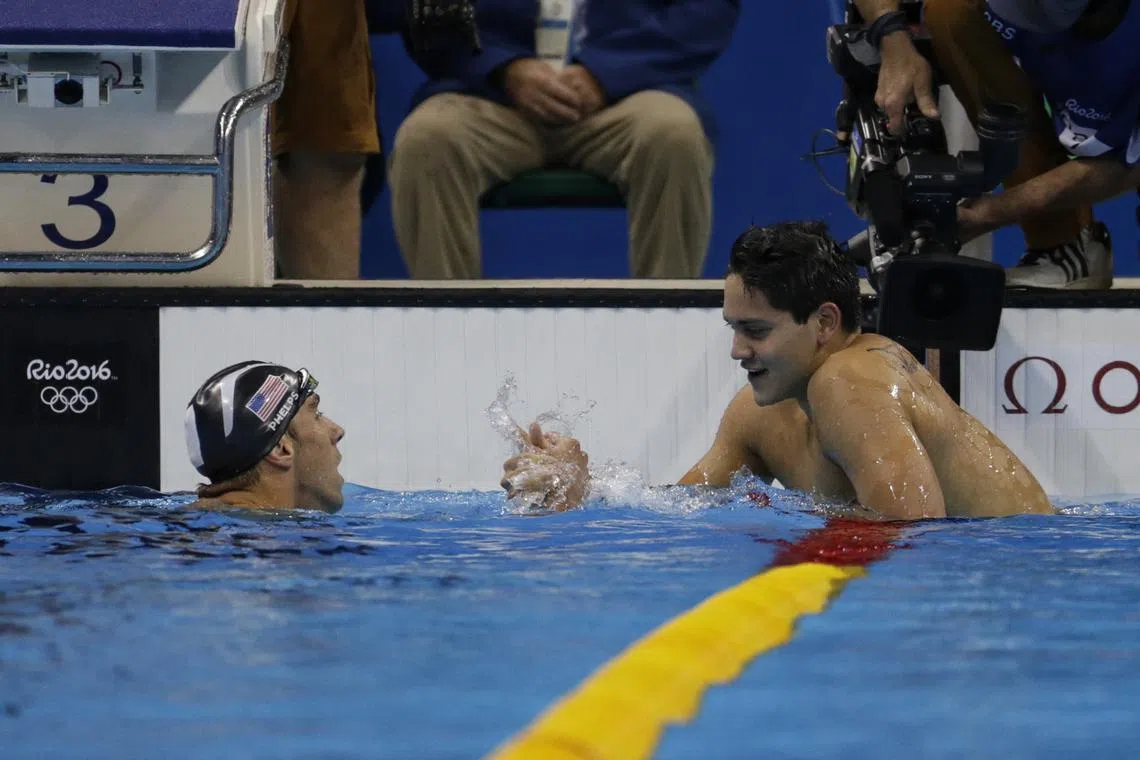 Joseph Schooling is congratulated by Michael Phelps after winning the 100m butterfly at the Rio 2016 Olympic Games.