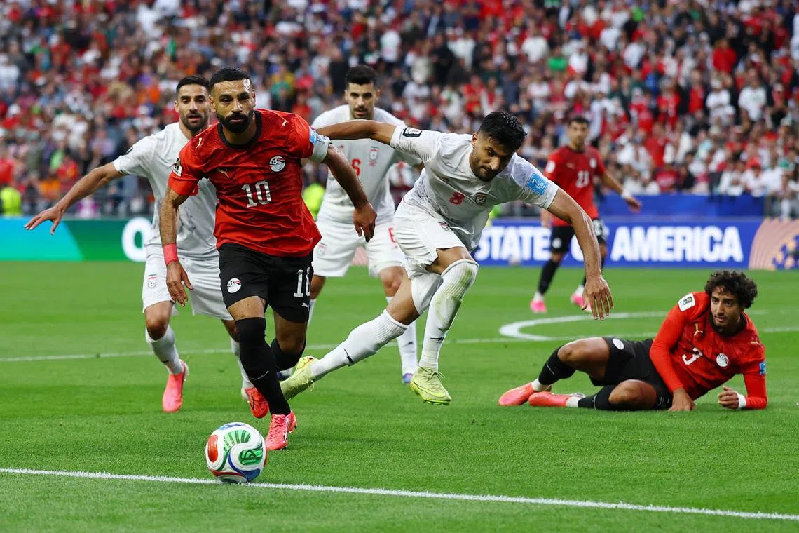 Soccer Football - FIFA World Cup 2026 - Group G - Egypt v Iran - Seattle Stadium, Seattle, Washington, U.S. - June 26, 2026 Egypt's Mohamed Salah in action with Iran's Mohammad Mohebbi REUTERS/Matthew Childs