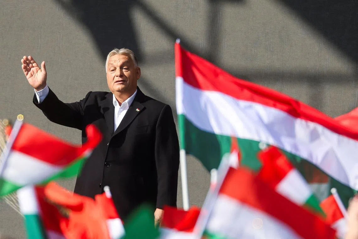 Hungarian Prime Minister Viktor Orban waves as he delivers a speech in Budapest, Hungary, October 23, 2024. REUTERS/Bernadett Szabo/File Photo