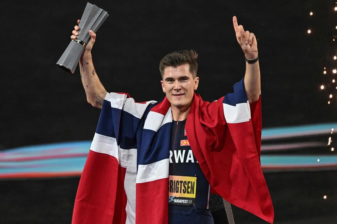 Norway’s Jakob Ingebrigtsen celebrates with the trophy after winning the men’s 5000m final.