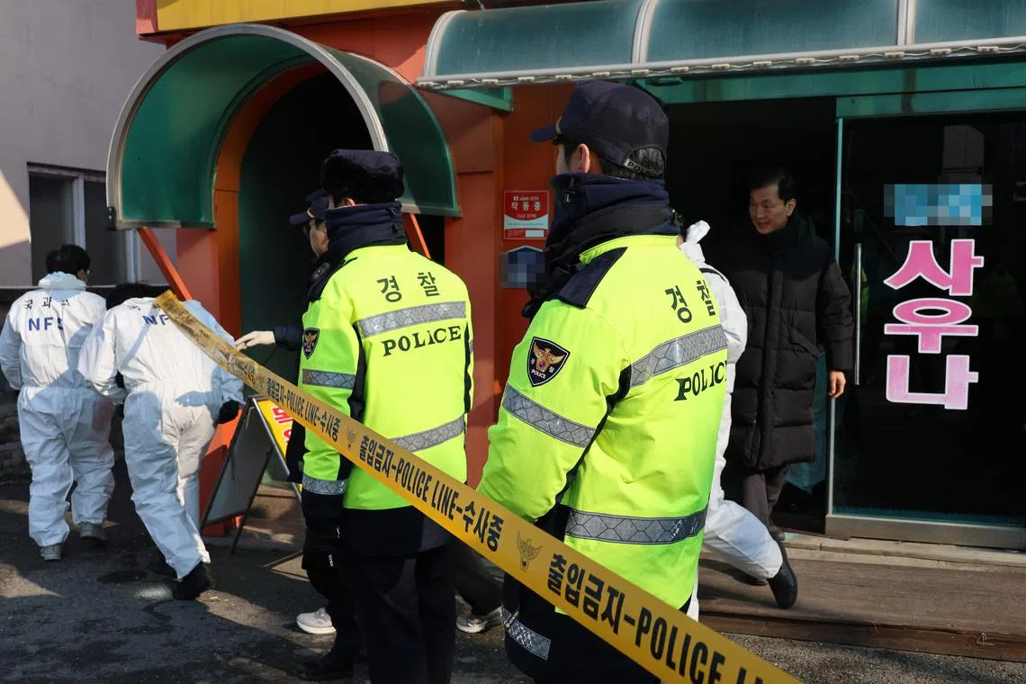 epa11042699 Police personnel stand guard in front of a cordoned-off public bathhouse in the central city of Sejong, South Korea 24 December 2023, after two elderly women died and one remained in a state of cardiac arrest from a suspected electrocution.  EPA-EFE/YONHAP SOUTH KOREA OUT