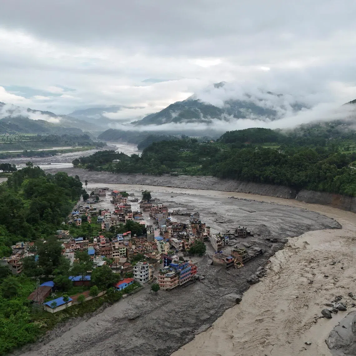 A drone view shows mud covering properties following a flash flood in Trishuli, Nuwakot district, Nepal, August 27, 2026. REUTERS/Navesh Chitrakar