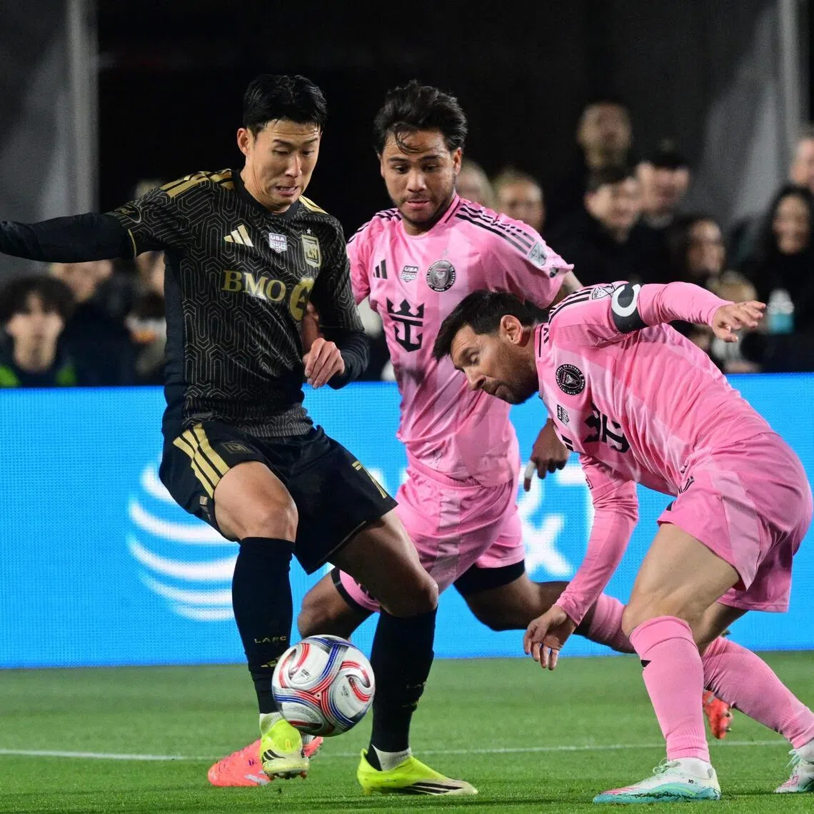 Los Angeles FC's Son Heung-min (left) fighting for the ball with Inter Miami's Lionel Messi as Telasco Segovia looks on during the Major League Soccer's opening match on Feb 21.