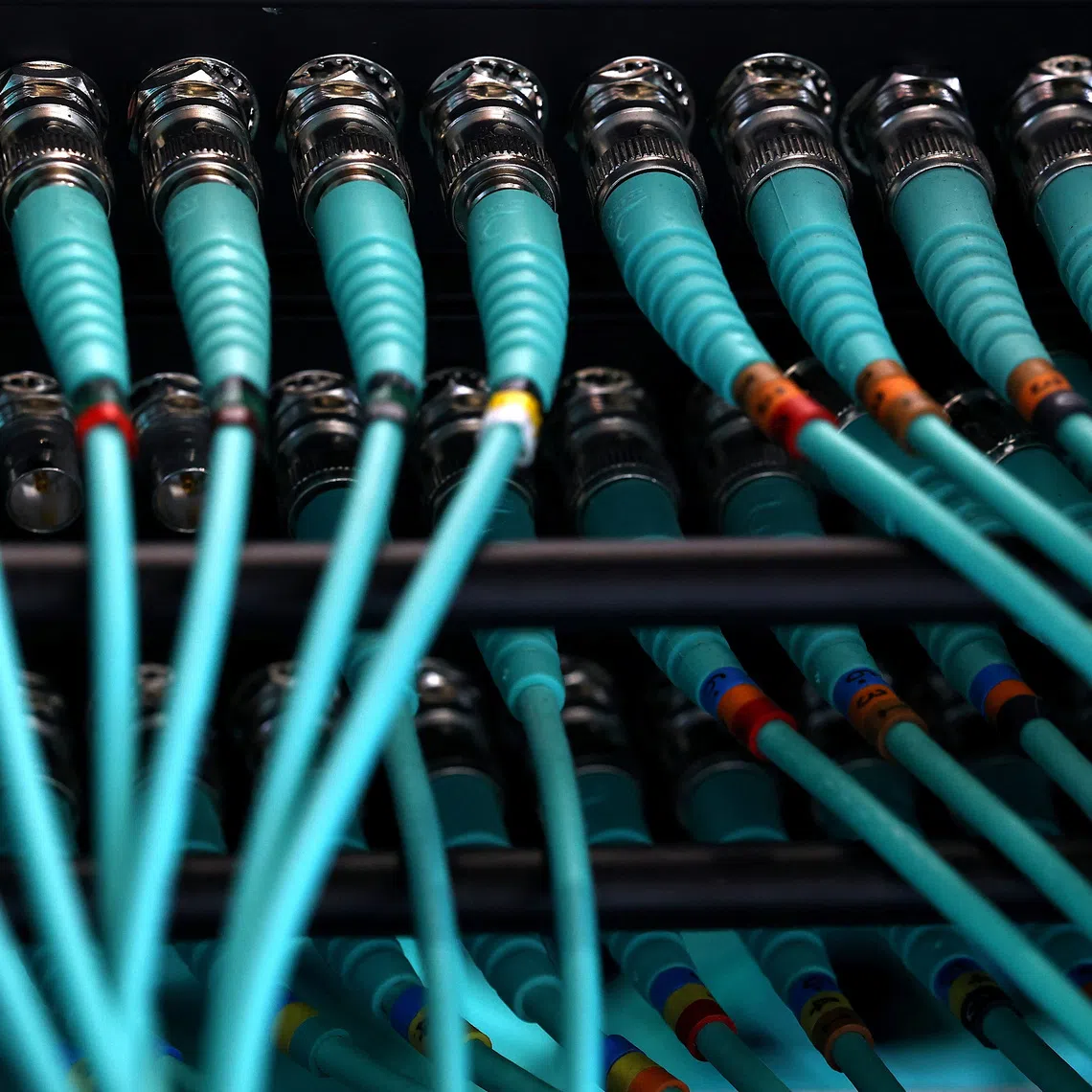 A photo illustration shows cables at a computer server, as cyber agencies warn that websites may be taken offline while PHP prepares a critical fix, in Berlin, Germany, October 22, 2026. REUTERS/Lisi Niesner