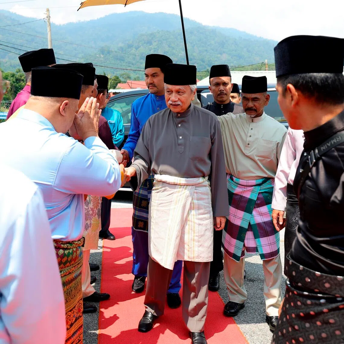 The Yang di-Pertuan Besar of Negeri Sembilan Muhriz Munawir being greeted by his subjects at Friday prayers on June 5, even as rebel aristocrats installed a replacement the same day.