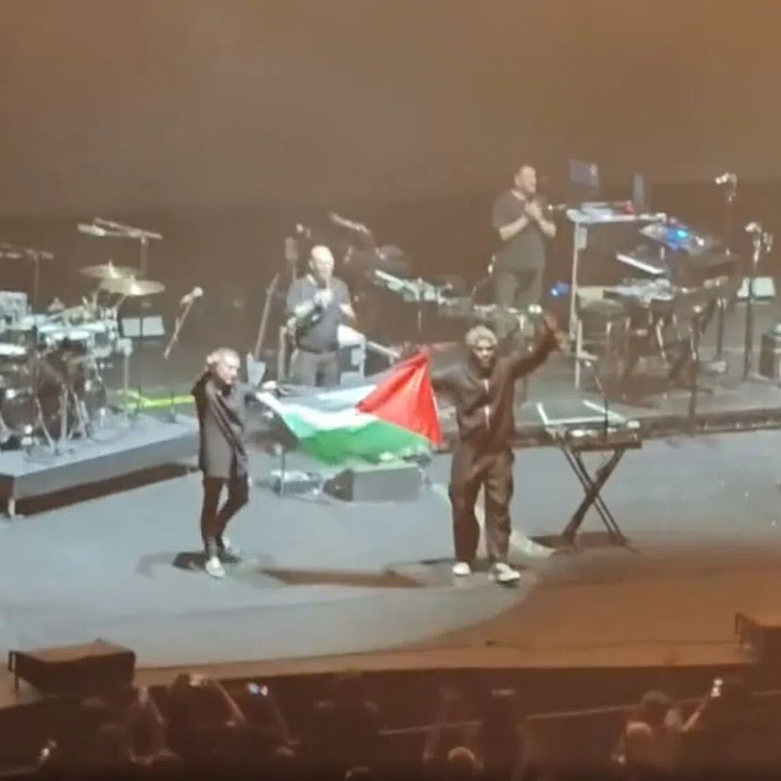 Two band members were seen holding a Palestinian flag on stage during Massive Attack’s concert on July 29.
