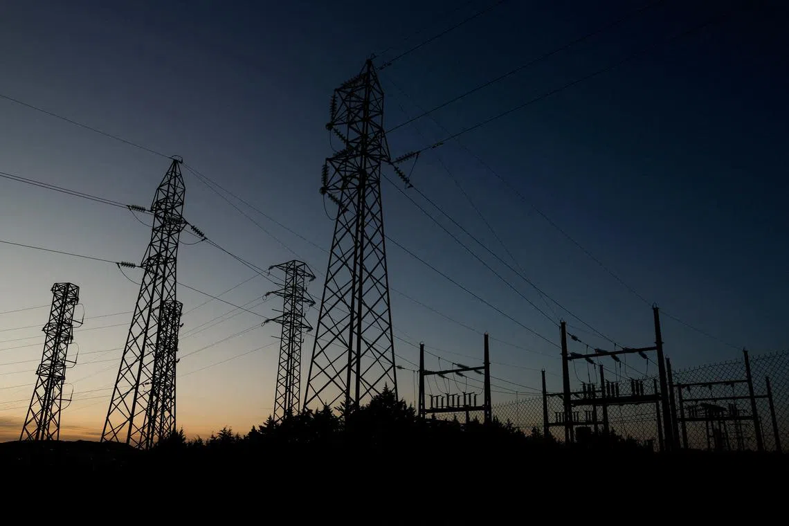 FILE PHOTO: Power lines connecting pylons of high-tension electricity are seen during sunset at an electricity substation on the outskirts of Ronda, during a blackout in the city, Spain April 28, 2025. REUTERS/Jon Nazca/File Photo