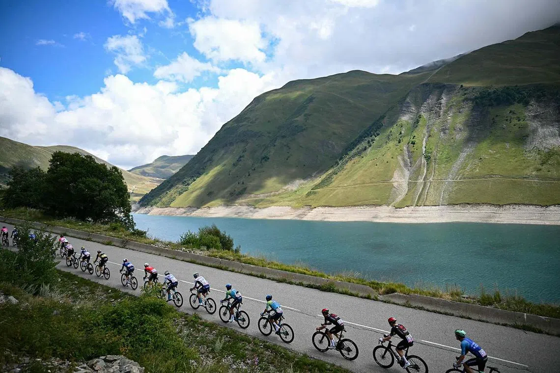 The pack of riders cycling near Col de la Madeleine during the 18th stage of the 112th edition of the Tour de France cycling race in the Alps, southeastern France, on July 24, 2025. 