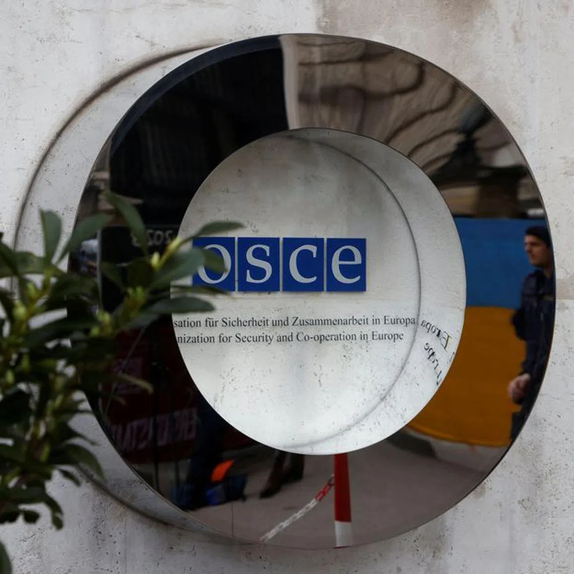 The OSCE sign is seen outside Hofburg Palace as a Parliamentary Assembly of the Organization for Security and Cooperation in Europe (OSCE) takes place in Vienna, Austria, February 23, 2023. REUTERS/Leonhard Foeger/File Photo