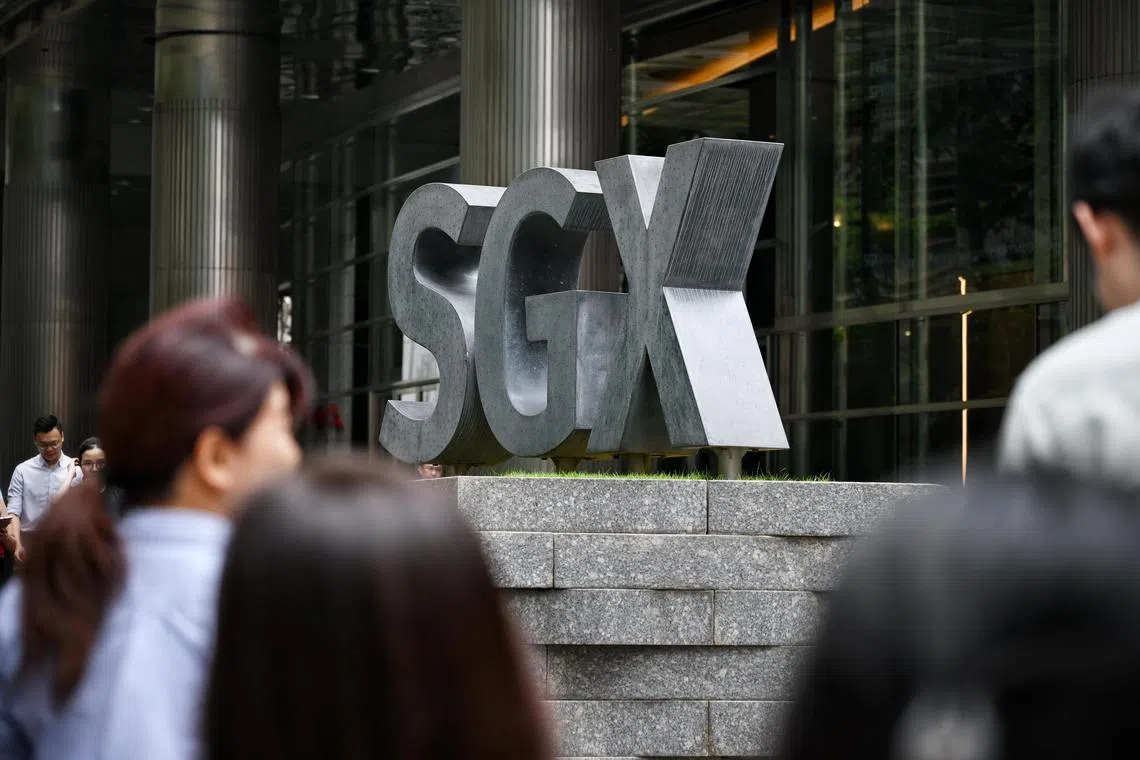 Pixgeneric / Generic pix of the lunchtime crowd walking next to the SGX logo at the SGX Centre 1, located in Shenton Way, on April 22, 2024.

