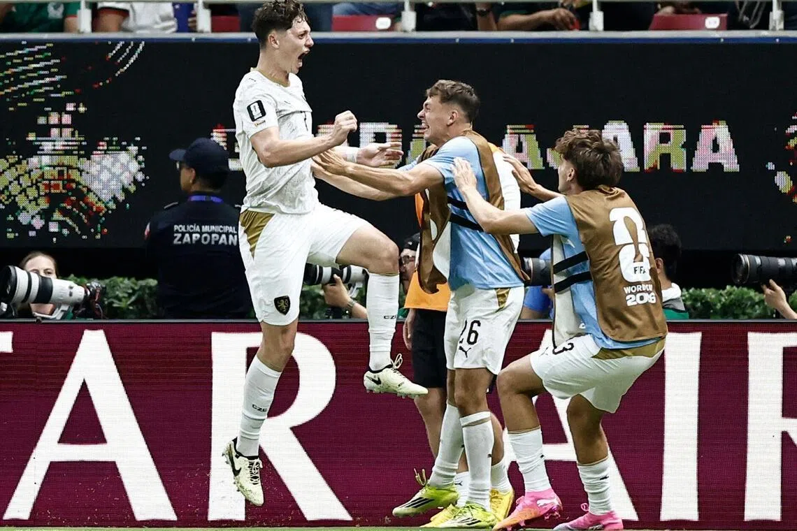 Czech defender Ladislav Krejci (left) celebrating with teammates after scoring his team's first goal during the match against South Korea on June 11. 