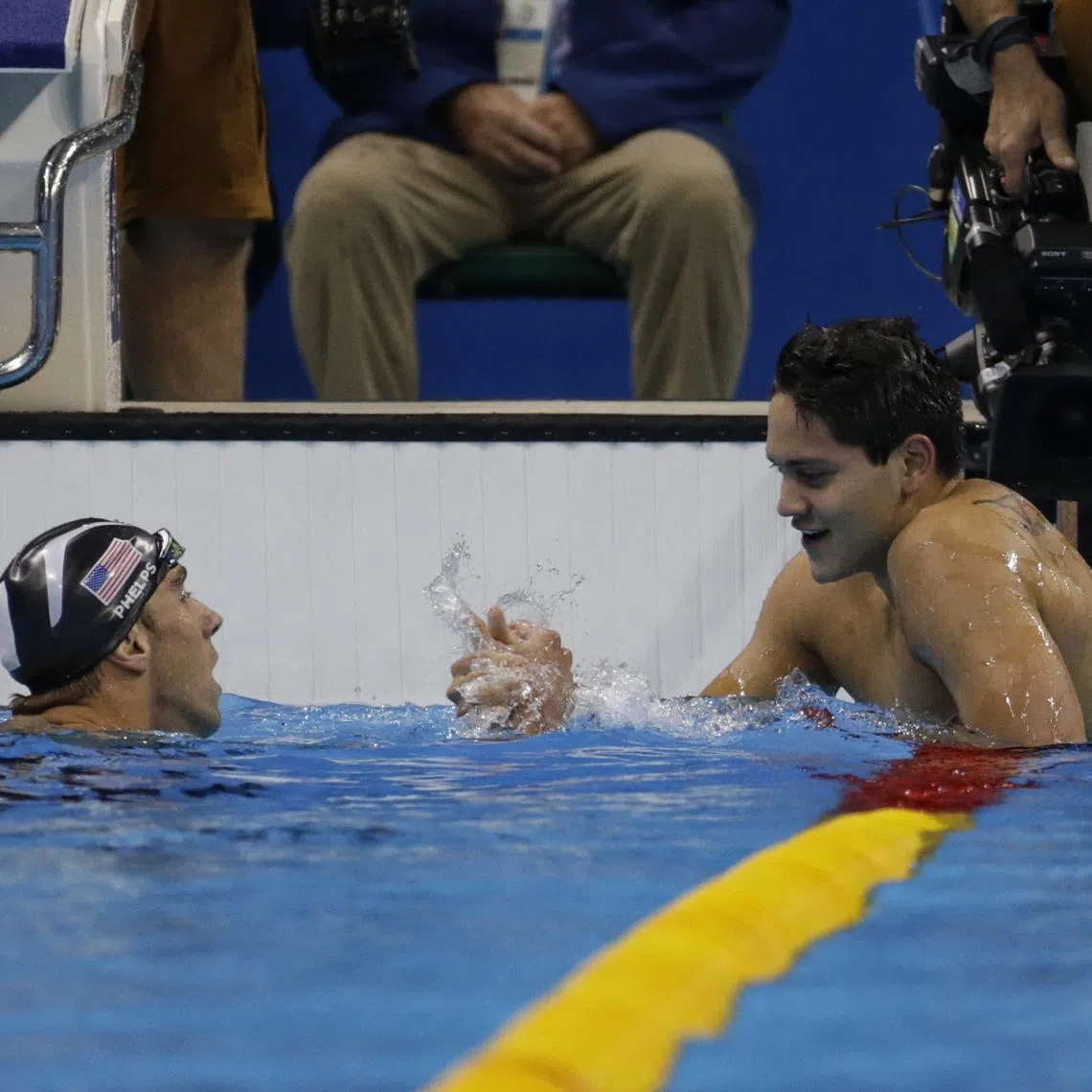 Joseph Schooling is congratulated by Michael Phelps after winning the 100m butterfly at the Rio 2016 Olympic Games.