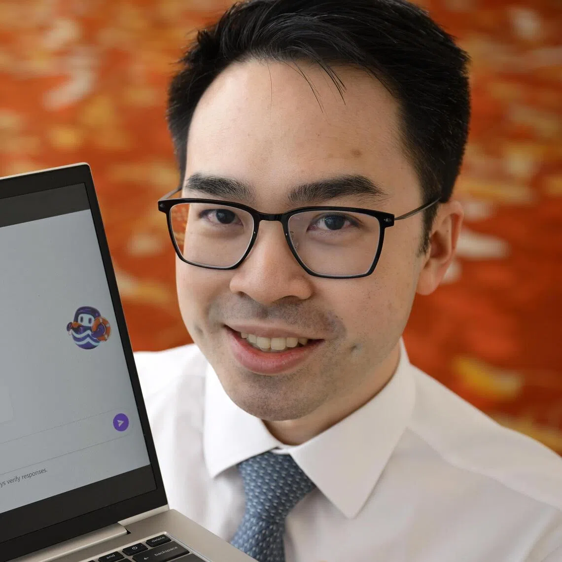 Cardiologist Kenneth Chew with a clinical assistant tool he developed using AgentSea, an agentic AI platform developed by Synapxe.