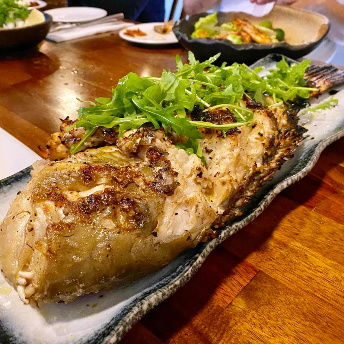 Chef-owner Jonathan Tan grilled a whole tuskfish caught by a customer.
