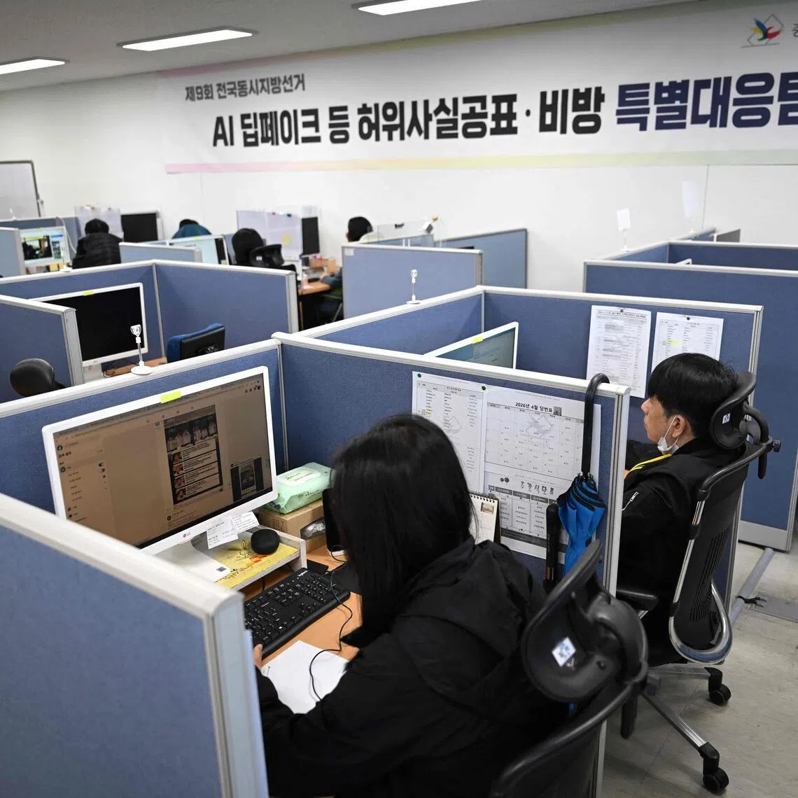 Workers searching for fake content through social media related to election campaigns at the headquarters of the National Election Commission in Gwacheon, South Korea, on April 16.