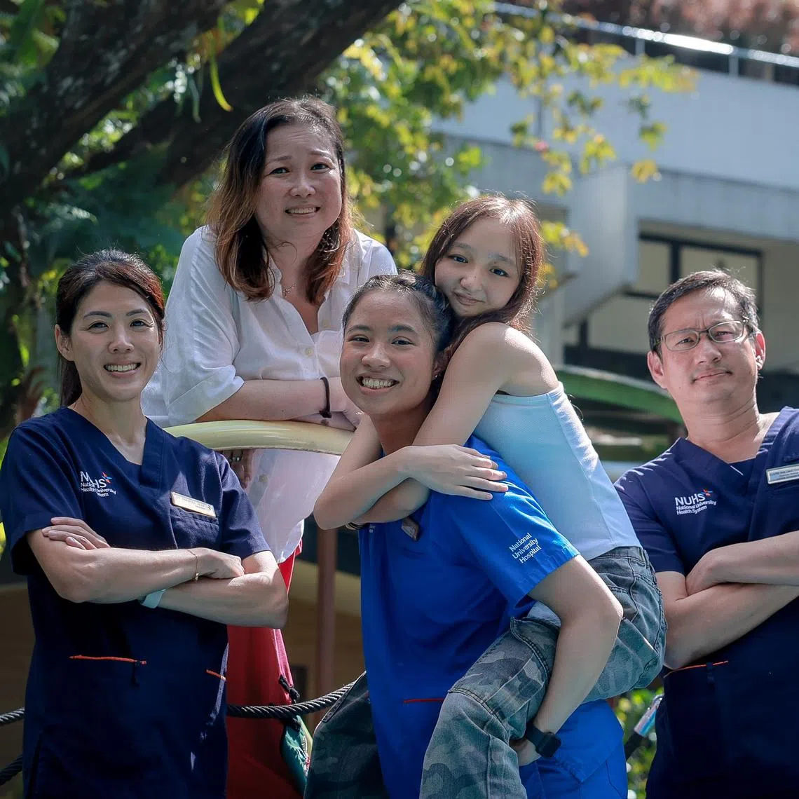 Sara Grace Kueh (centre) with (from left) Dr Frances Yeap, her oncologist, mother Esther Kueh, sister Isabelle Joy Kueh and Adjunct Professor Mark Puhaindran.
