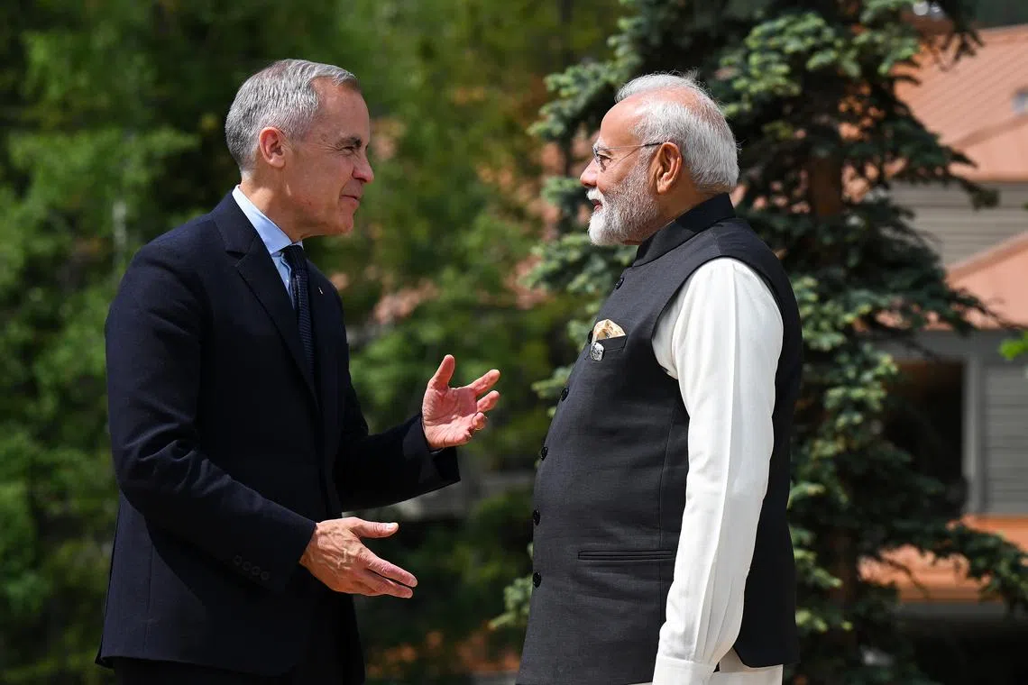Canadian PM Mark Carney (left) greeting Indian PM Narendra Modi at the Group of Seven Leaders’ Summit in Canada in 2025. Mr Carney is scheduled to travel on to New Delhi for talks with Mr Modi.