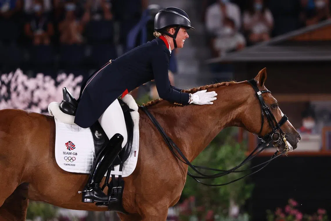 FILE PHOTO: Tokyo 2020 Olympics - Equestrian - Dressage - Individual - Grand Prix Freestyle - Equestrian Park - Tokyo, Japan - July 28, 2021. Charlotte Dujardin of Britain on her horse Gio reacts REUTERS/Hamad I Mohammed/File Photo