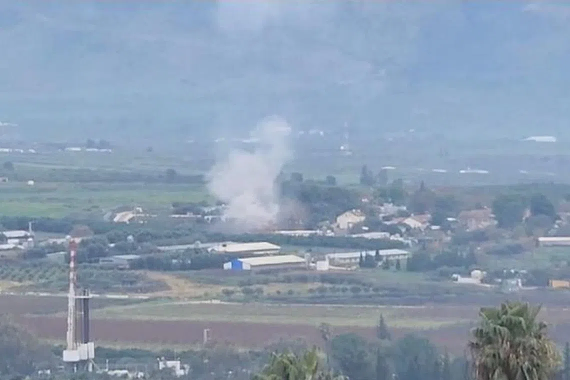 Smoke rises above Kfar Yuval following a rocket strike that, according to Israel's ambulance service, was fatal, near Israel's Lebanese border in northern Israel, January 14, 2024, in this screen grab taken from a handout video. Guard Israel/Handout via REUTERS