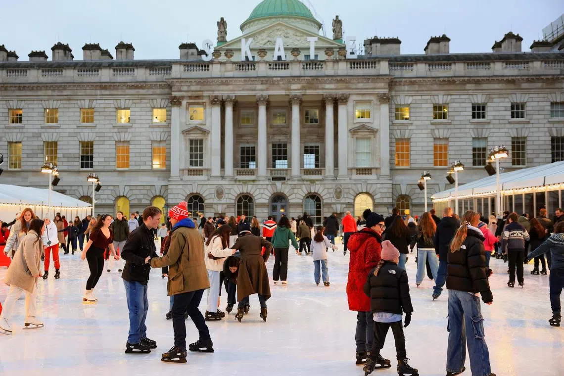 Visitors ice skate at Somerset House, in London, Britain, December 17, 2024. REUTERS/Mina Kim 