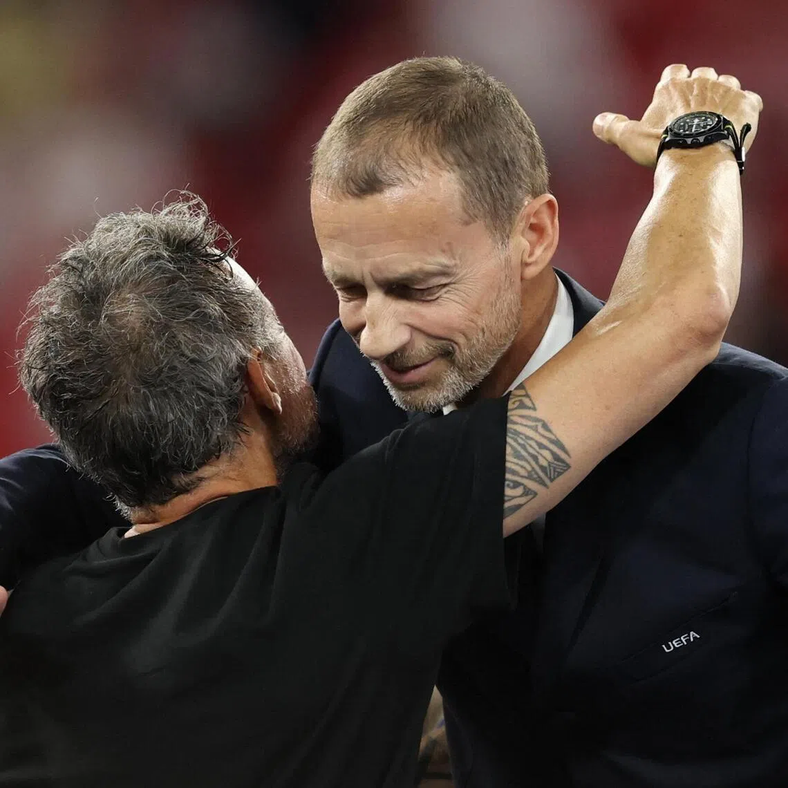 UEFA president Aleksander Ceferin (right) embracing Paris Saint-Germain coach Luis Enrique after the Champions League final win over Arsenal at the Puskas Arena in Budapest on May 30, 2026.