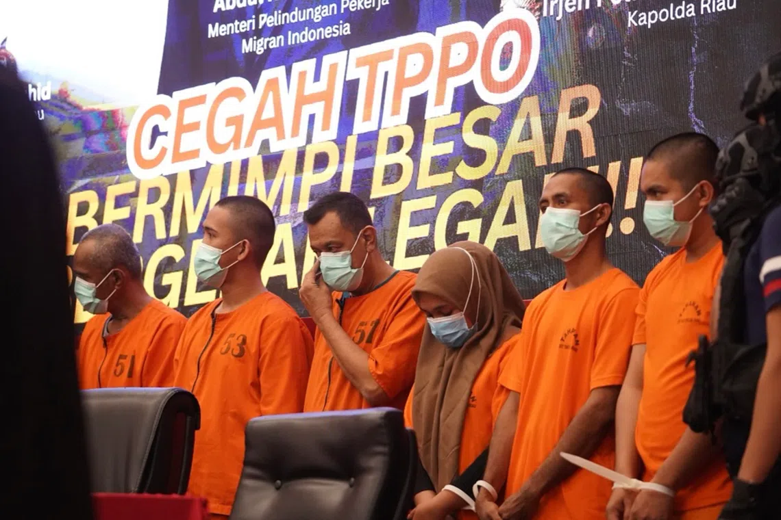 Human trafficking suspects at the Riau Police headquarters in Pekanbaru on July 17.