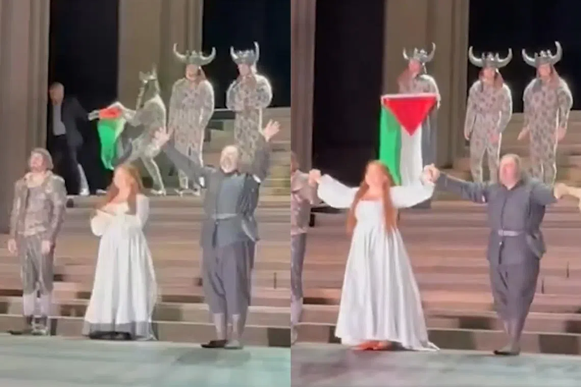 Video footage posted online shows a brief scuffle at the edge of the stage as a person unsuccessfully tries to stop the performer from holding up the Palestinian flag.