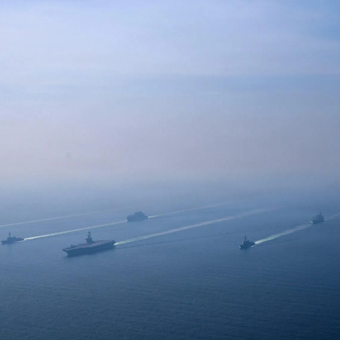 The US Navy's Nimitz-class aircraft carrier USS Abraham Lincoln leading its strike group during a photo exercise in the Arabian Sea on Feb 6.