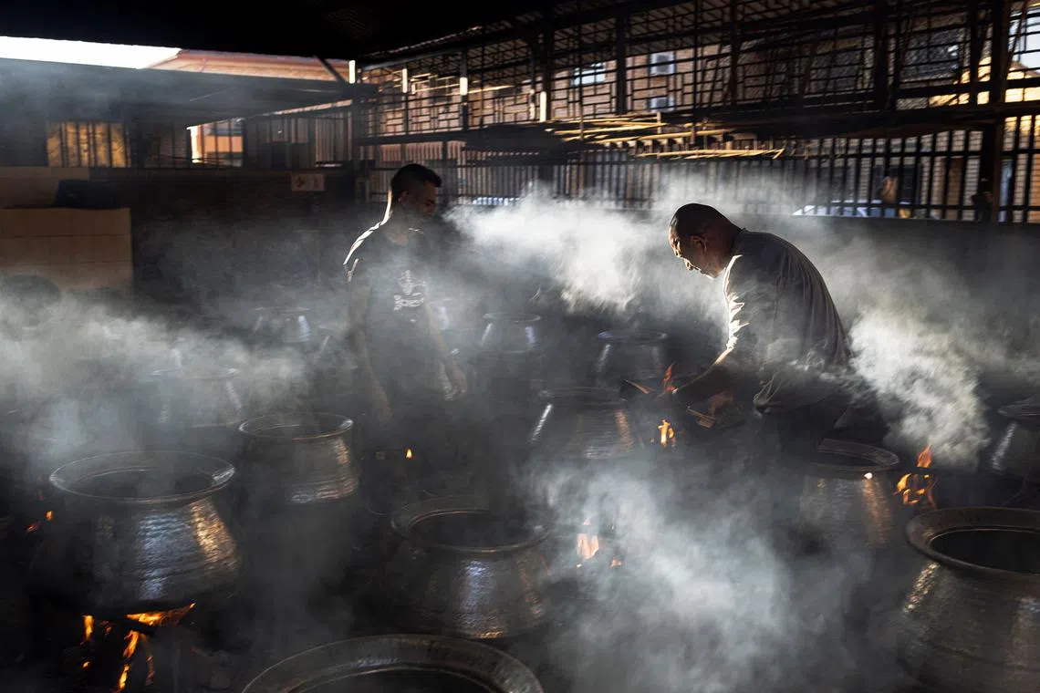 Muslim volunteers at the Saaberie Chishty Mosque preparing meals to be distributed in a charity food distribution on the Muslim festival of Eid al-Fitr in Lenasia, South Africa, on April 10, 2024. 