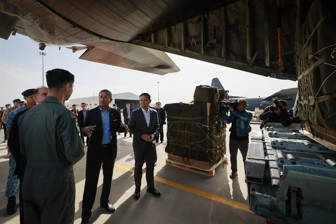 Foreign Minister Vivian Balakrishnan (second from left) and Senior Minister of State for Defence Zaqy Mohamad (third from left) speaking with SAF personnel at King Abdullah II Airbase in Jordan, on March 17.