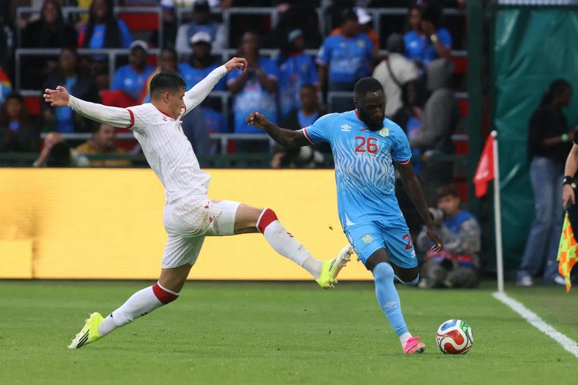 Soccer Football - International Friendly - Democratic Republic of Congo v Denmark - Stade Maurice Dufrasne, Liege, Belgium - June 3, 2026 Democratic Republic of Congo's Arthur Masuaku in action with Denmark's Adam Daghim REUTERS/Nicolas Economou